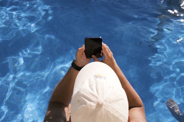 a photograph of a person is taking a picture of a person in a pool