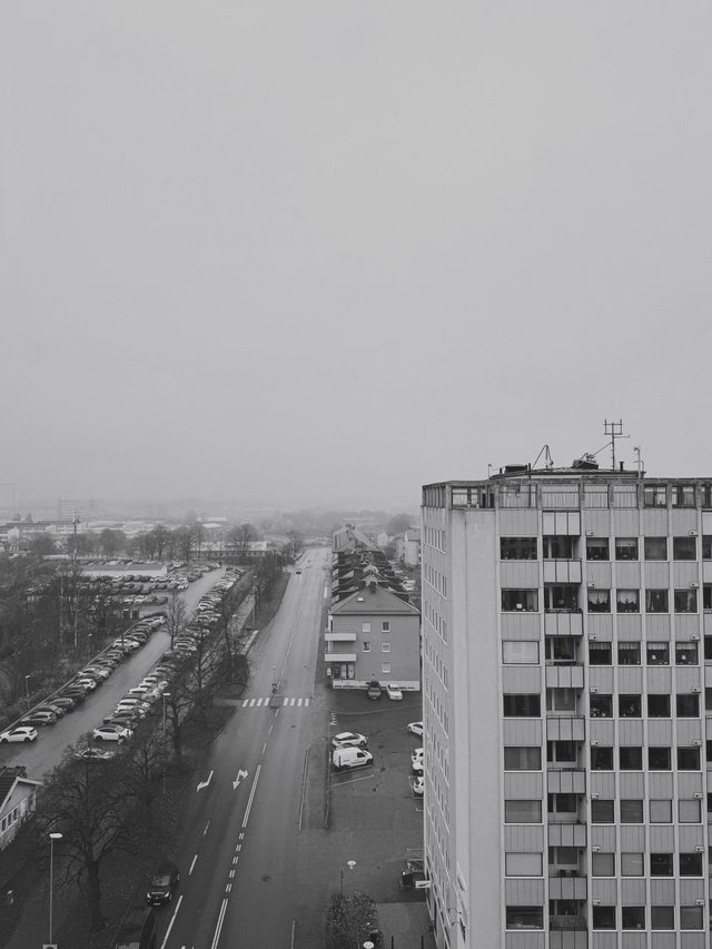a photograph of a black and white photo of a city street