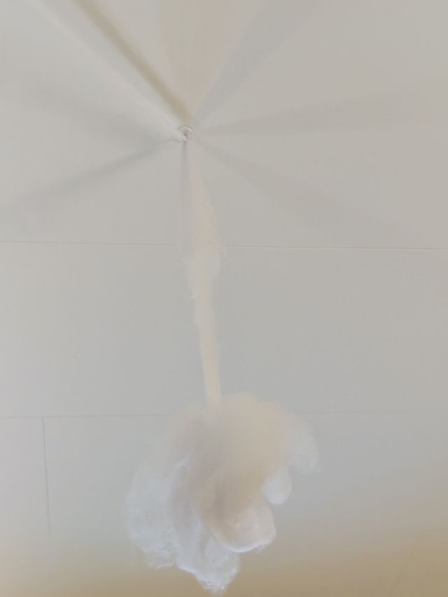 a photograph of a white umbrella with a white umbrella and a white umbrella