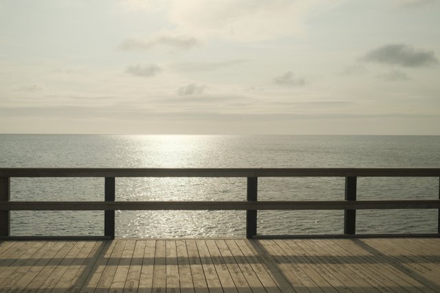 a photograph of a bench with a bench and a bench in the background