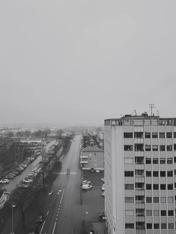 a photograph of a black and white photo of a city street