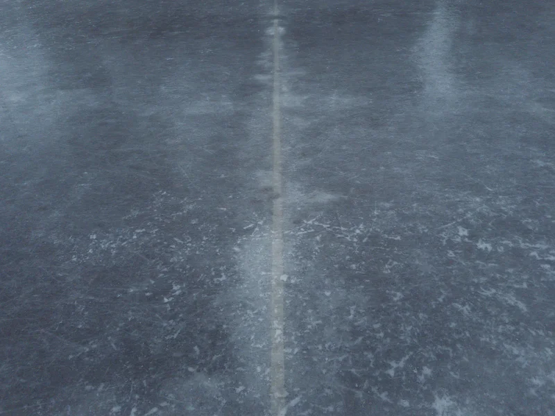 Ice surface with a vertical reflection line down the center.